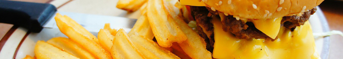 Eating American (Traditional) Burger at Burgers & Brew restaurant in Sacramento, CA.